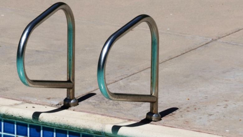 Swimming pool handles