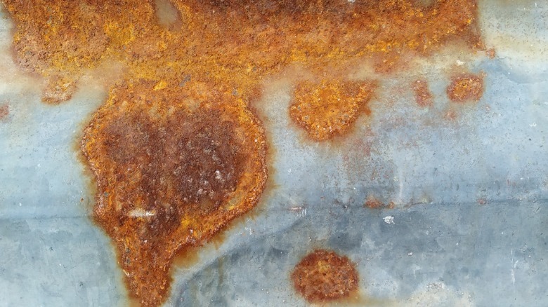 Rusted metal spots close up