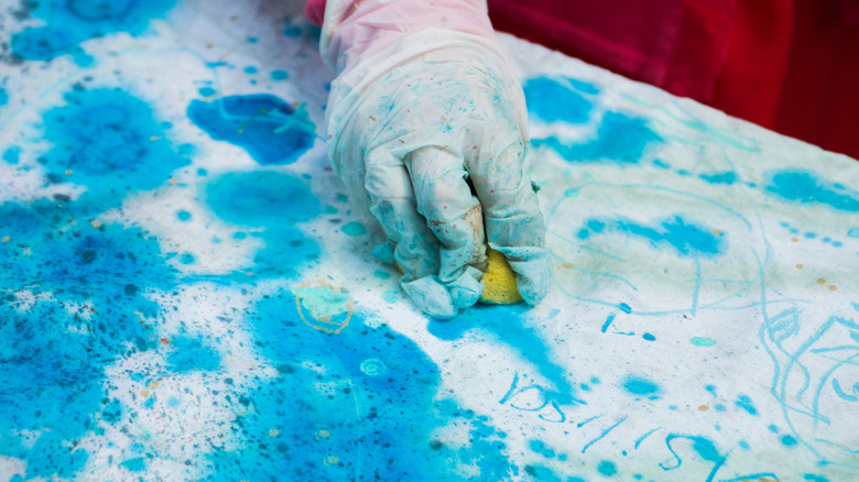 Painting fabric using a sponge