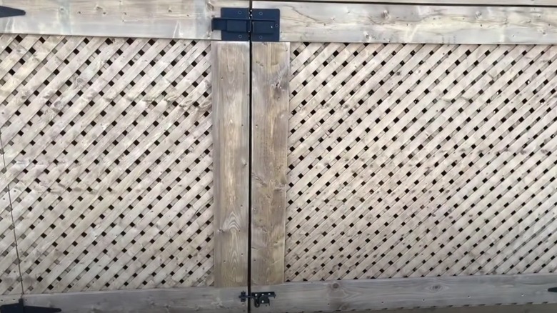 Lattice fence gate with black latches