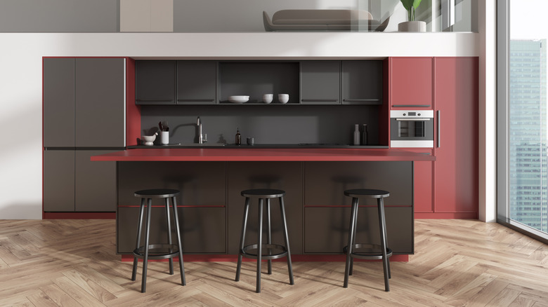 Muted red and black kitchen