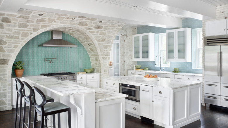 A light and airy kitchen with aqua accents