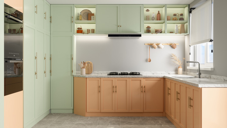 Peach and mint kitchen cabinets look unique.