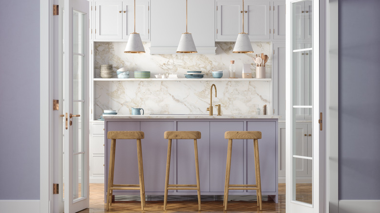 Kitchen with periwinkle walls and gold accents