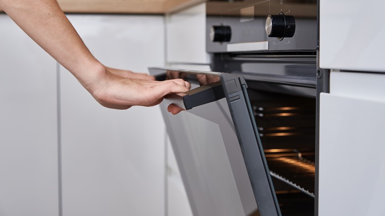 Opening the oven door