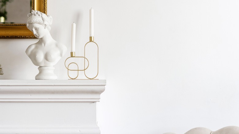 white marble bust on mantle