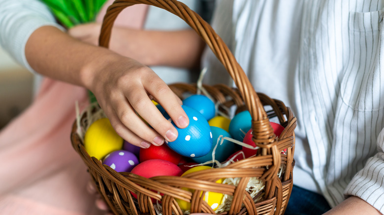 Easter basket with colorful eggs 