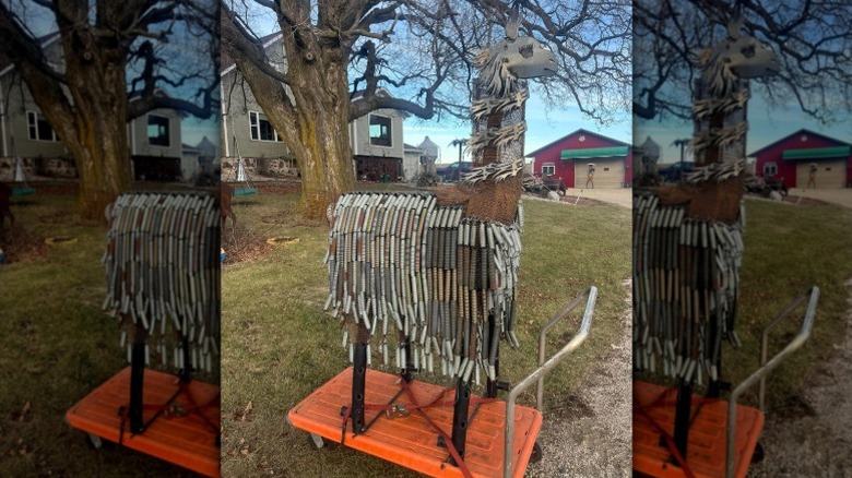 A llama made from scrap metal and trampoline springs for its fur.