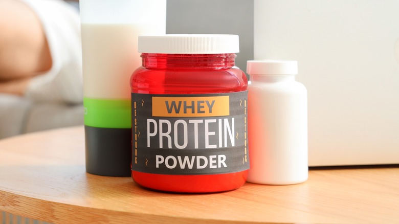 protein powder container on table