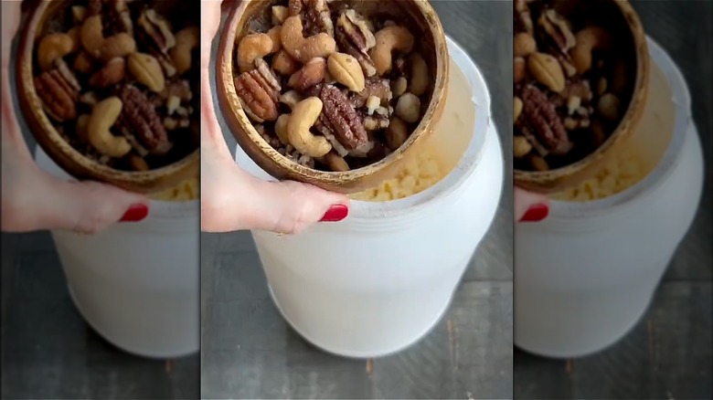 white container with nuts in lid