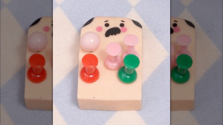 colorful pushpins in eraser