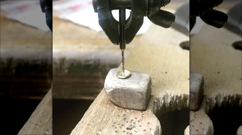 drilling jewelry piece on eraser