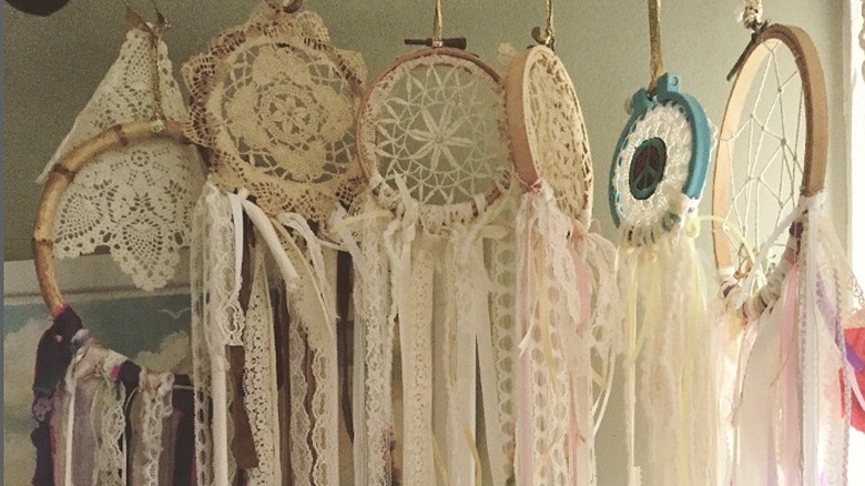 Six hanging dreamcatchers made from lace and doilies