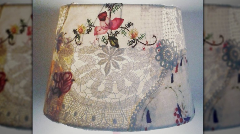 Lampshade covered in floral fabric and doilies