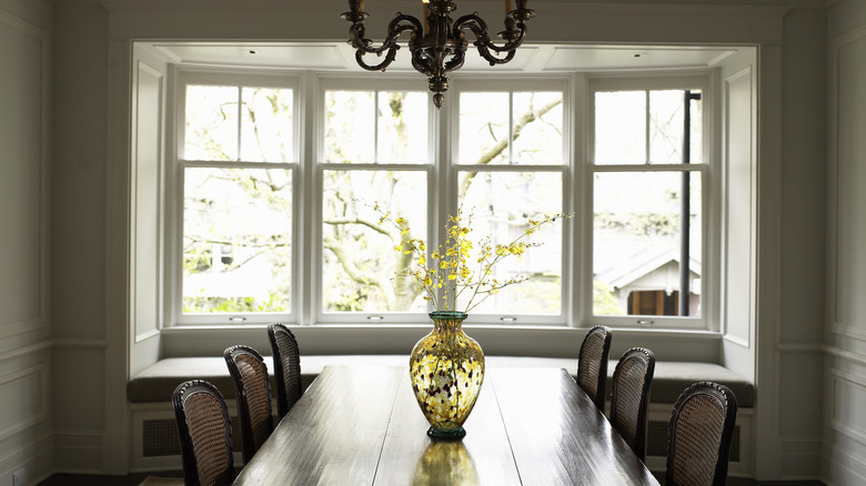 Dining room with wooden table and chandelier