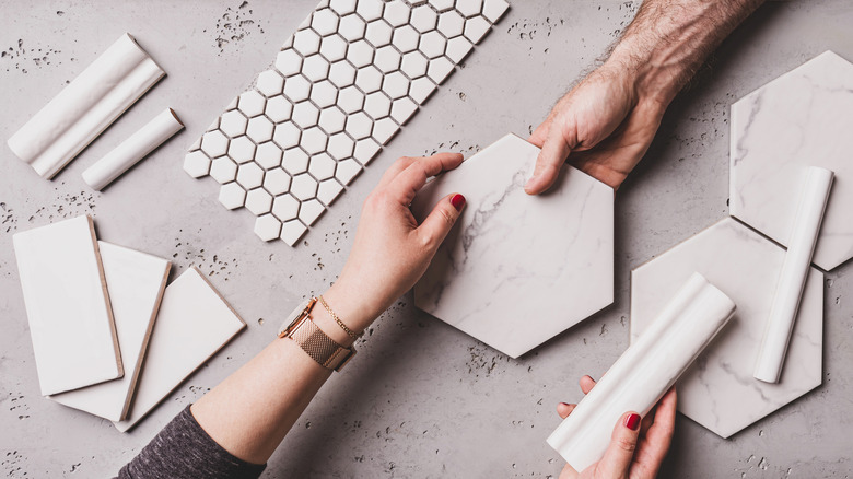 Different types of white ceramic and gray tiles