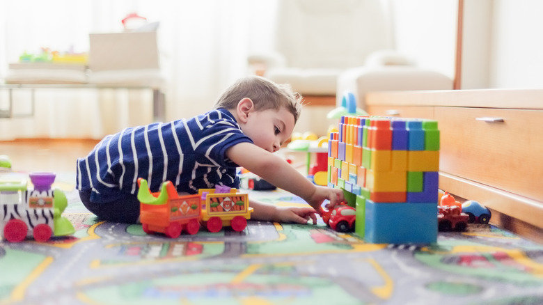 toddler with toys