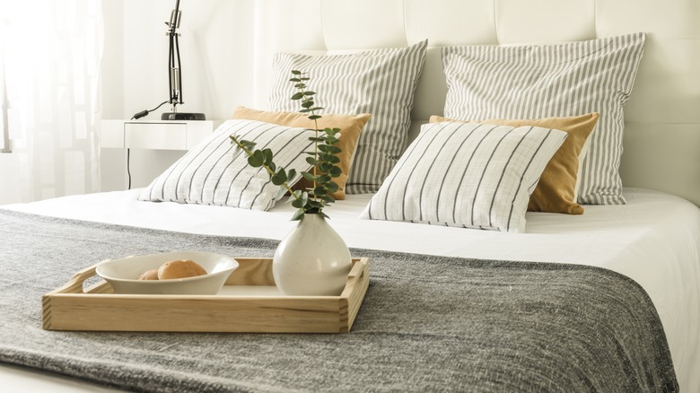 wooden tray on bed