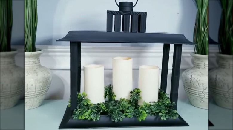 black lantern with white candles