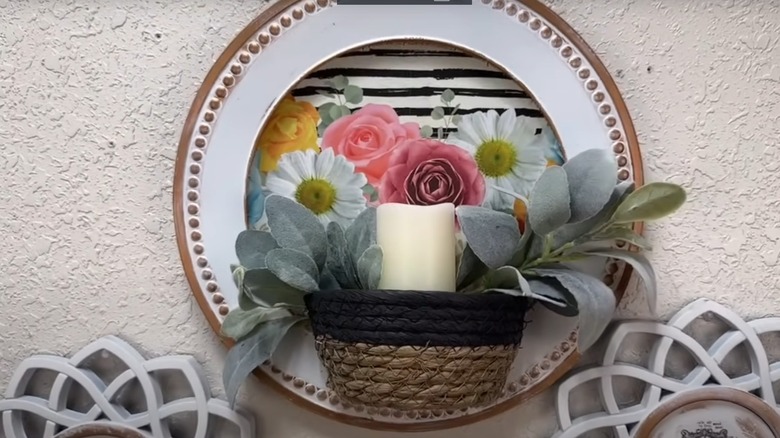 floral sconce on wall