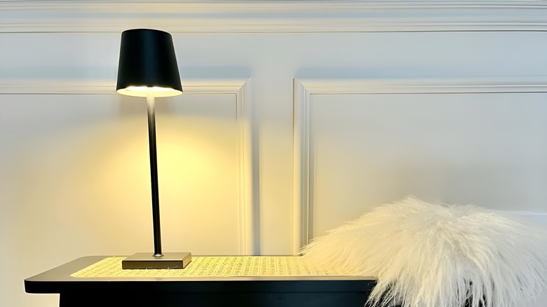 Cordless battery-powered lamp on table