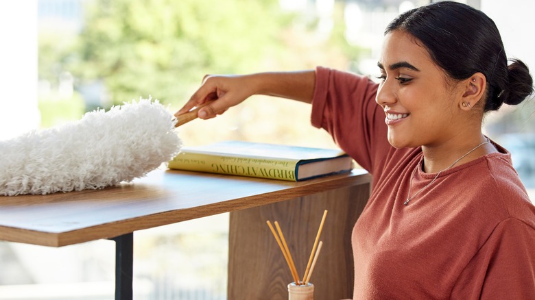 woman dusting 