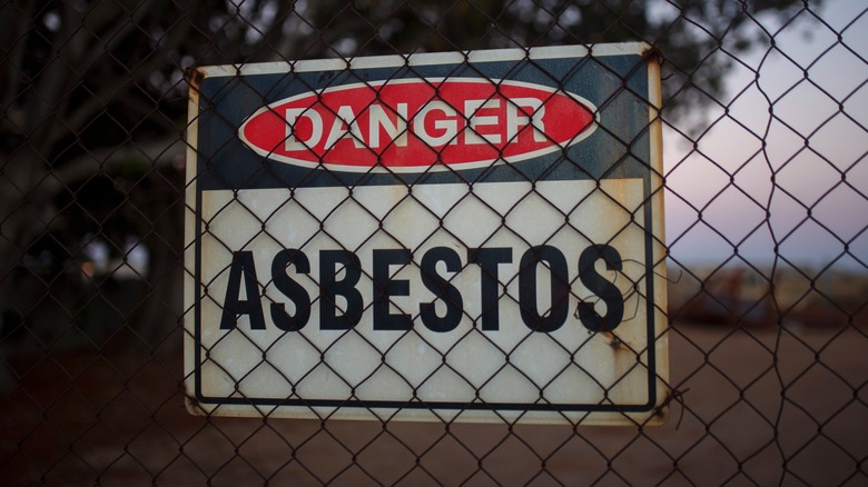 asbestos sign on fence