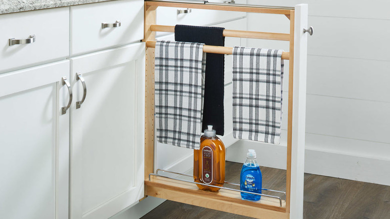 Cabinet filler towel rack