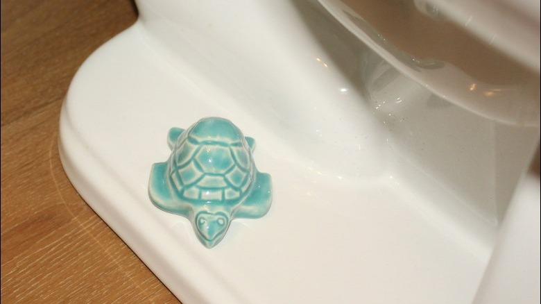 Teal turtle toilet bolt cover 