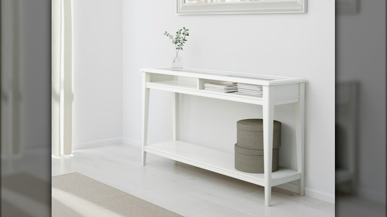 White glass top console table