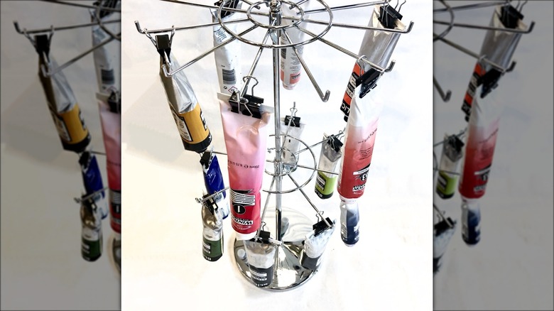 paint tubes hanging on jewelry organizer