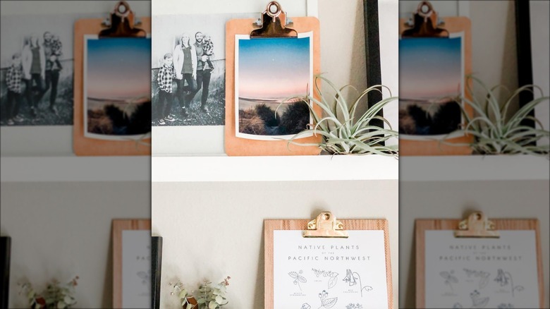 clipboard frames on white shelf