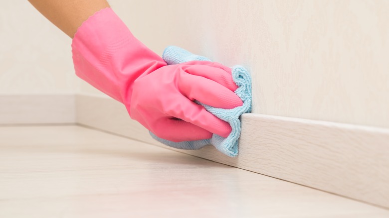 Wiping down baseboards