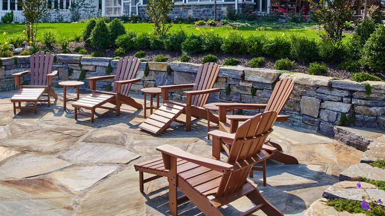 Wooden lounge chairs in backyard