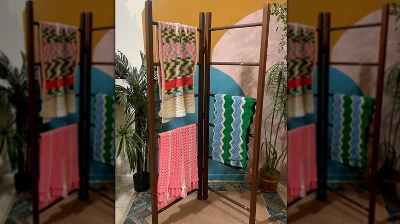 Room divider with wood dowels and blankets