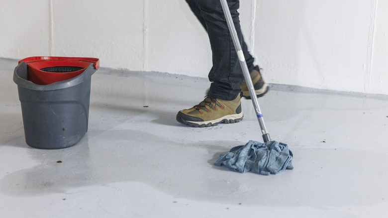 Person mopping the garage floor