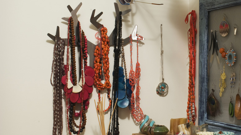 A hanging necklace organizer