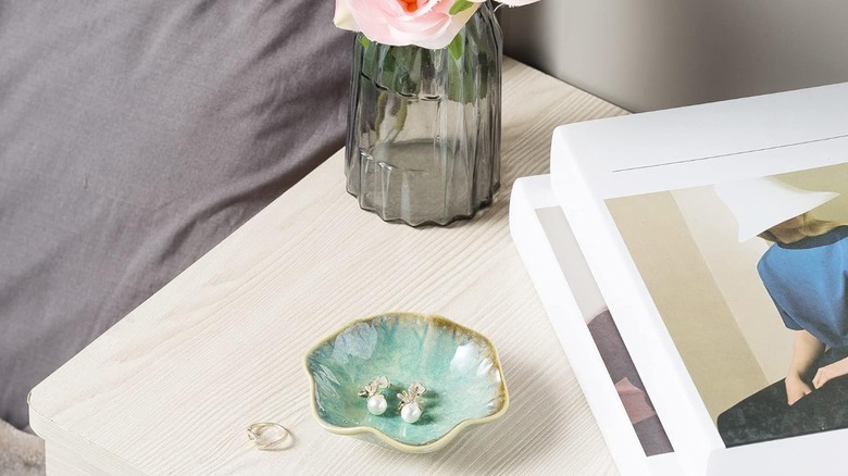 A jewelry dish on a nightstand