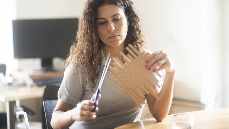 Cutting up a milk carton