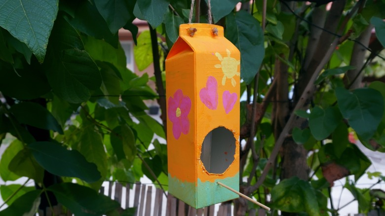 milk carton turned into birdhouse