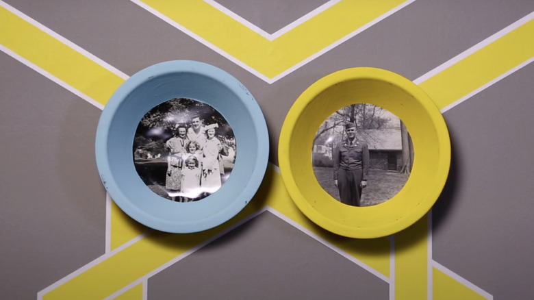 Up-cycled pie tin photo frames containing photos of family members.