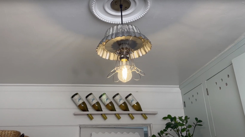 A kitchen pendant light made from vintage pie tins.