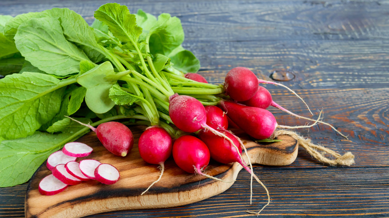 radishes on cutting board