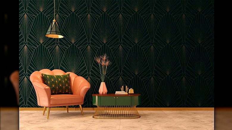 Pink armchair with green wallpaper