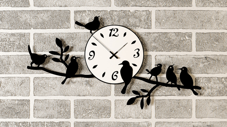 wall clock with bird art