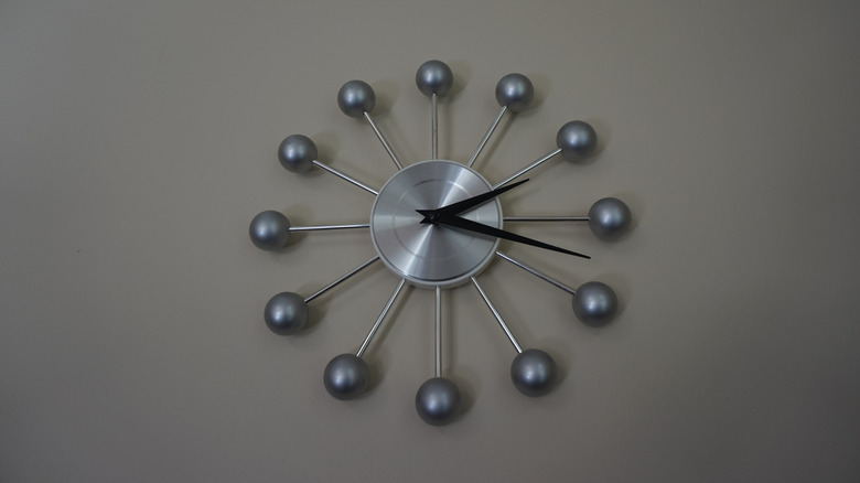 chrome clock on a wall