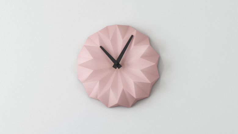 pink clock on a wall