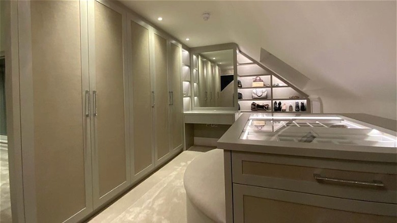 Elegant neutral attic walk-in closet