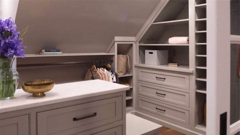 Neutral elegant walk-in attic closet 