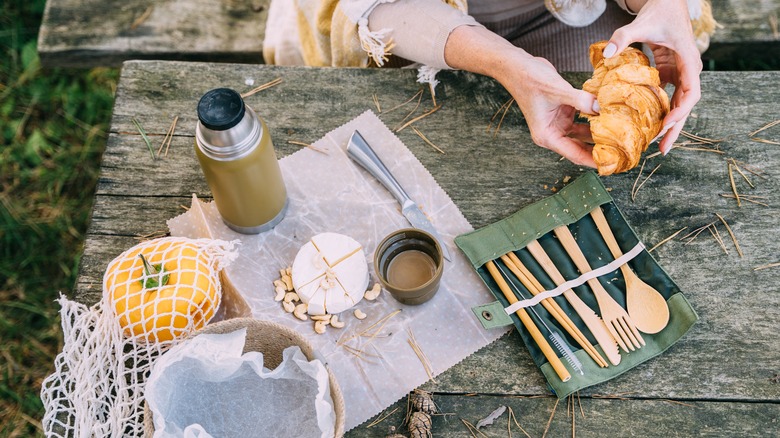 Person eating with bamboo cutlery